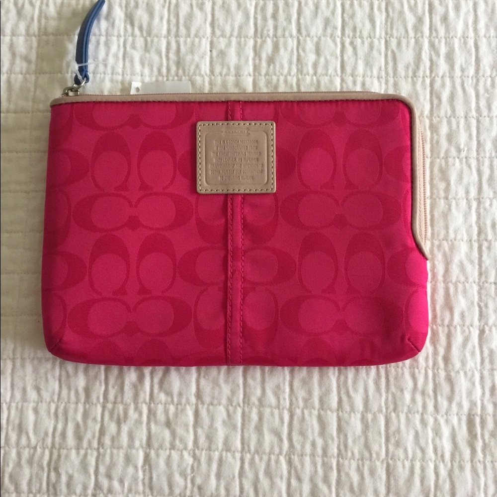 NWT Coach fuchsia tablet case.